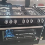 Cuisinière 5 feux Haier dimension 90×60 inox noire full option