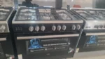 Cuisinière 5 feux Haier dimension 90×60 inox noire full option